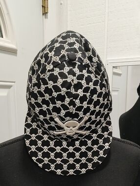 Source Unknown Black Hat with White Skull Pattern
